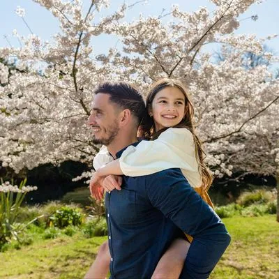 Father and daughter looking at the Cherry Blossoms at the Christchurch Botanic Gardens