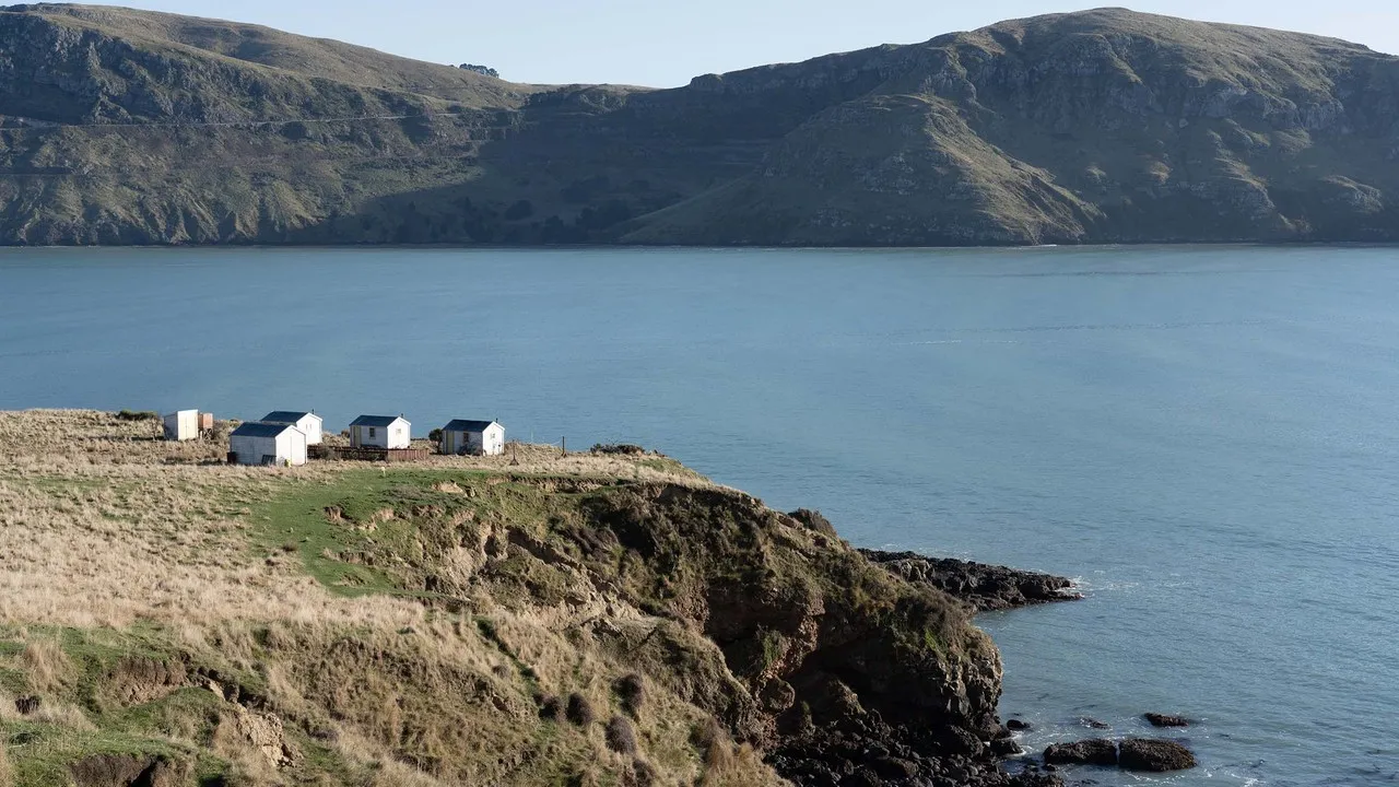 Huts on cliff on set of We Were Dangerous