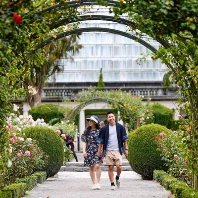 Couple strolling through the Christchurch Botanic Gardens.